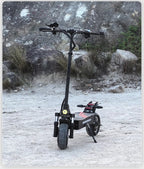 Ride & Spin Co. black foldable electric scooter with dual 3200W motors, 10-inch tires, and hydraulic brakes, set against a rocky, outdoor backdrop.