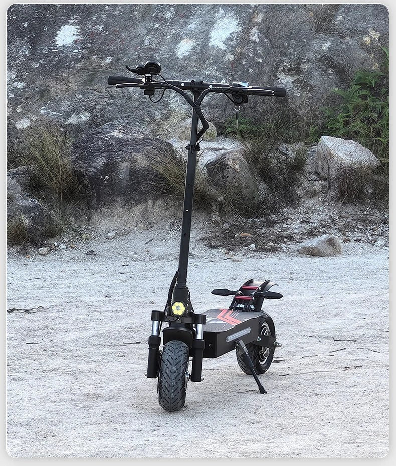 Ride & Spin Co. black foldable electric scooter with dual 3200W motors, 10-inch tires, and hydraulic brakes, set against a rocky, outdoor backdrop.